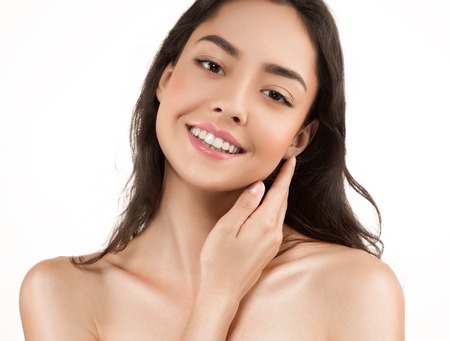Beauty Woman face Portrait. Beautiful model Girl with Perfect Fresh Clean Skin. Youth and Skin Care Concept. Isolated on a white backgroundの写真素材