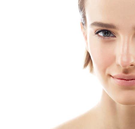 Beauty Woman half-face Portrait. Beautiful model Girl with Perfect Fresh Clean Skin color lips purple red. Blonde brunette short hair Youth and Skin Care Concept. Isolated on a white backgroundの写真素材