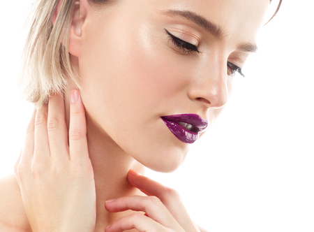 Beauty Woman face Portrait. Beautiful model Girl with Perfect Fresh Clean Skin color lips purple red. Blonde brunette short hair Youth and Skin Care Concept. Isolated on a white backgroundの写真素材