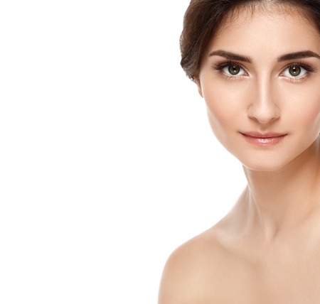 Beautiful Face of Young Woman Model with Clean Fresh Perfect Healthy Skin. Age and Health Concept. Beauty Woman Portrait isolated on whiteの写真素材