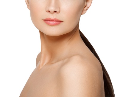 Beautiful Brunette Woman Portrait lips, nose, shoulders with healthy Hair.Clear Fresh Skin.Smiling Girl Isolated on a White Background.Skincare.Spa.Beauty Modelの写真素材