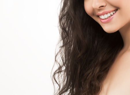Lips and nose Woman happy young beautiful studio portrait with healthy skin. Studio shot. Isolated on white.の写真素材