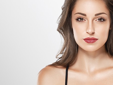 Young beautiful woman face portrait with healthy skinの写真素材