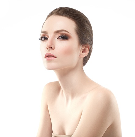 Young beautiful woman face portrait with healthy skin. Studio shot.の写真素材