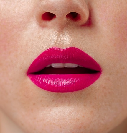 Woman lips close up red lipstick. Close up view. Studio shot.の写真素材
