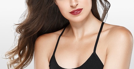 Lips neck smile chin shoulders woman portrait. Studio shot.の写真素材