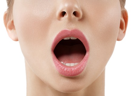 Open mouth woman close up. Studio shot.の写真素材