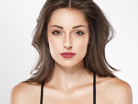 Young beautiful woman face portrait with healthy skinの写真素材