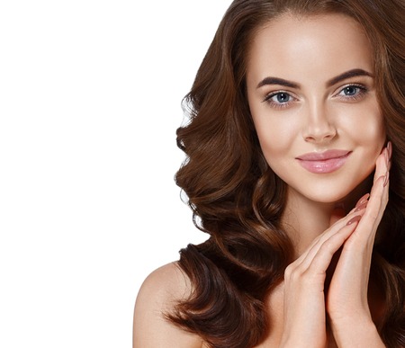 Beautiful woman face close up portrait long beautiful hair young studio on whiteの写真素材