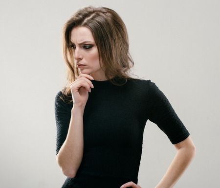 Portrait of beautiful young curly hair woman girl in black dress. Fashion photoの写真素材