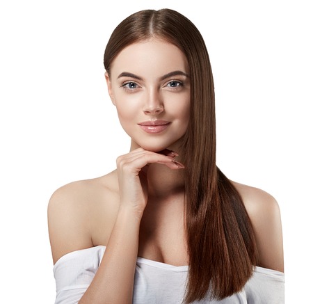 Beautiful woman portrait face with long healthy hair studio. Studio shot. Isolated on white.の写真素材