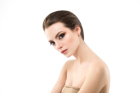 Young beautiful woman face portrait with healthy skin. Studio shot.の写真素材