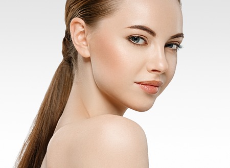 Amazing Woman face young beautiful healthy skin portrait. Studio shot.の写真素材