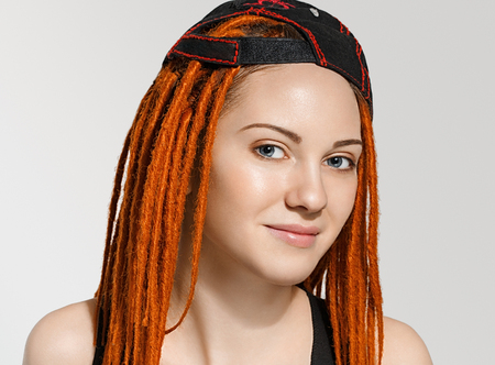 Close up Pretty Young Woman Face with Dreadlocks Red Hair. Studio shot.の写真素材