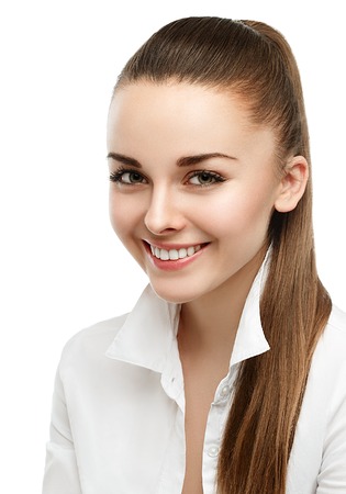 Happy smiling businesswoman with hair tail, isolated on white background. Studio shot.の写真素材