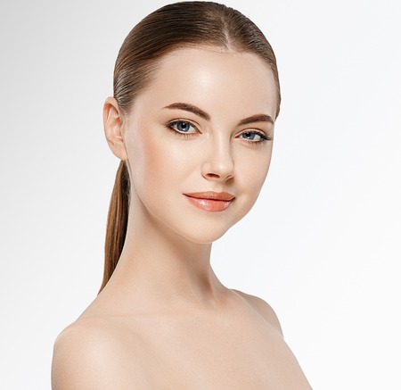 Beautiful woman face studio on white with sexy lips.の写真素材
