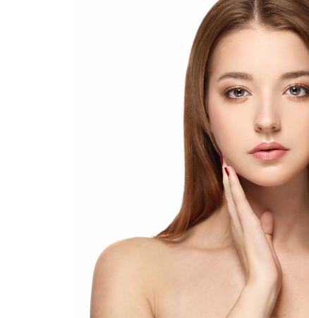 Beautiful Woman Face portrait with Clean Fresh Skin close up. Skin care face.Cosmetology. Studio shot.の写真素材