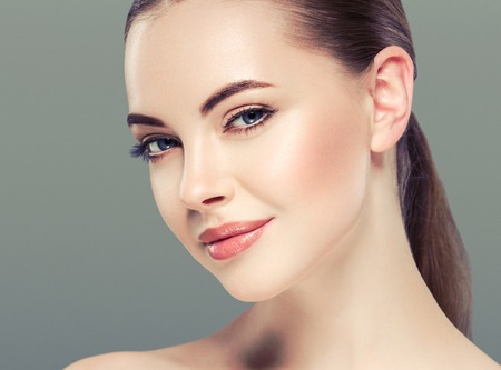Woman beauty portrait isolated on white skin care concept on blue backgroundの写真素材