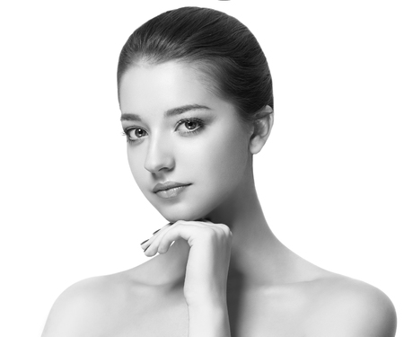 Beauty Woman face Portrait. Black and white. Beautiful model Girl with Perfect Fresh Clean Skin. Youth and Skin Care Concept.の写真素材