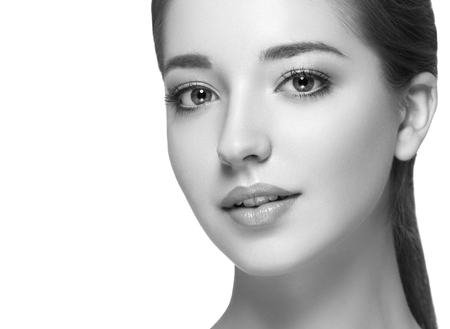 Beauty Woman face Portrait. Black and white. Beautiful model Girl with Perfect Fresh Clean Skin. Youth and Skin Care Concept.の写真素材