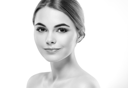 Beauty Woman face Portrait. Black and white. Beautiful model Girl with Perfect Fresh Clean Skin. Youth and Skin Care Concept.の写真素材
