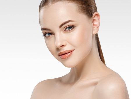 Amazing Woman face young beautiful healthy skin portrait. Studio shot.の写真素材