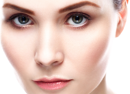 Woman Eyes Beauty portrait of attractive female. Skin care, cosmetics and makeup concept.Isolated on white. Healthy perfect skin.の写真素材