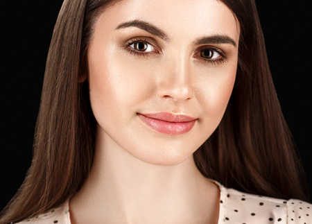 Fashion Beautiful woman portrait close up on black background. Studio shot.の写真素材