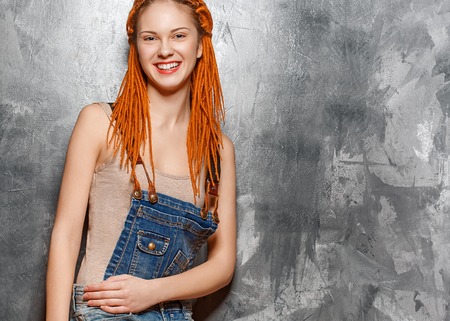 Dreadlocks woman red hair hipster portrait. Studio shot.の写真素材