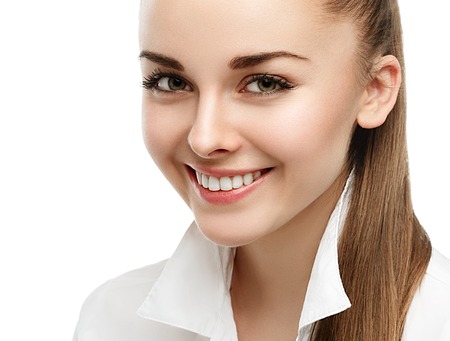 Happy smiling businesswoman with hair tail, isolated on white background. Studio shot.の写真素材
