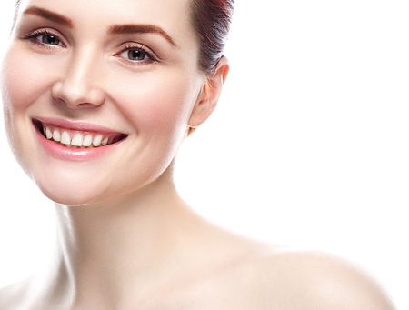 Woman Beauty portrait of attractive female smile healthy teeth. Skin care, cosmetics and makeup concept.Isolated on white. Healthy perfect skin.の写真素材