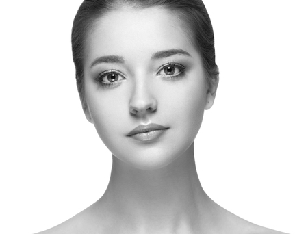 Beauty Woman face Portrait. Black and white. Beautiful model Girl with Perfect Fresh Clean Skin. Youth and Skin Care Concept.の写真素材