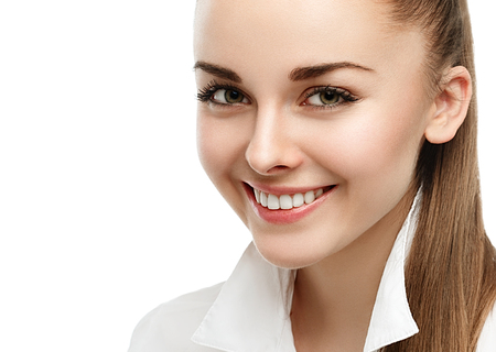 Happy smiling businesswoman with hair tail, isolated on white background. Studio shot.の写真素材