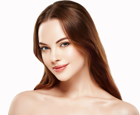 Beautiful woman face close up portrait young with beautiful hair. Isolated on white. Studio shot.の写真素材