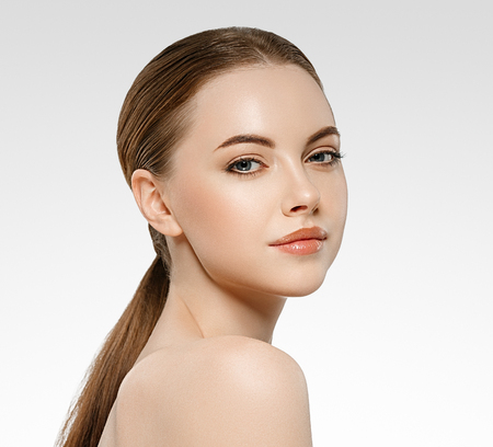 Beautiful woman face studio on white with sexy lips.の写真素材