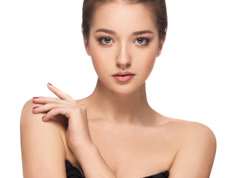 Beautiful Brunette Woman Portrait with healthy Hair.Clear Fresh Skin.Smiling Girl Isolated on a White Background.Skincare.Spa.Beauty Modelの写真素材