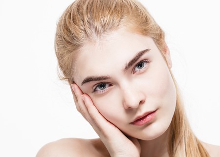 Blonde woman beauty portrait close-up isolated on white. Studio shot.の写真素材