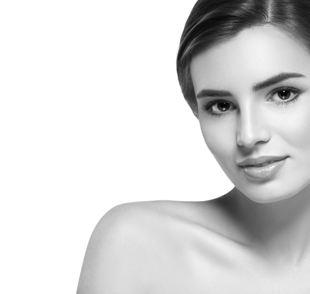 Beautiful woman portrait face. Isolated on white. Black and white. Studio shot.の写真素材