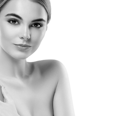 Blonde woman beauty portrait close-up. Isolated on white. Black and white. Studio shot.の写真素材
