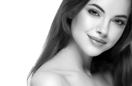 Beautiful woman portrait face. Isolated on white. Black and white. Studio shot.の写真素材