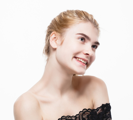 Amazing portrait of a beautiful young woman blond hair with perfect skin closeup. Studio shot.の写真素材