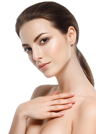Woman beauty portrait studio closeup with healthy skin. Studio shot. Isolated on white.の写真素材