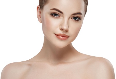 Beautiful woman face close up portrait young. Isolated on white. Studio shot.の写真素材
