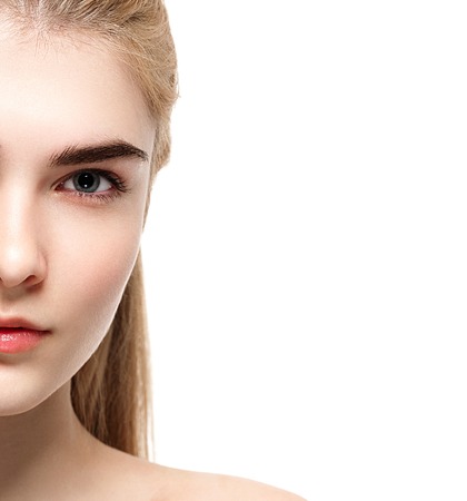 Blonde woman beauty portrait close-up isolated on white. Studio shot.の写真素材