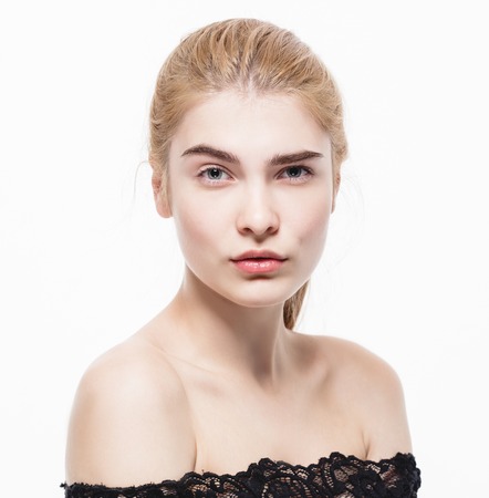 Amazing portrait of a beautiful young woman blond hair with perfect skin closeup. Studio shot.の写真素材