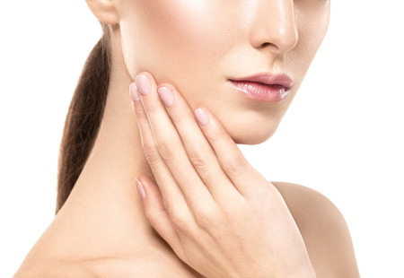 Woman shoulders lips hands fingers close-up portrait. Studio shot.の写真素材