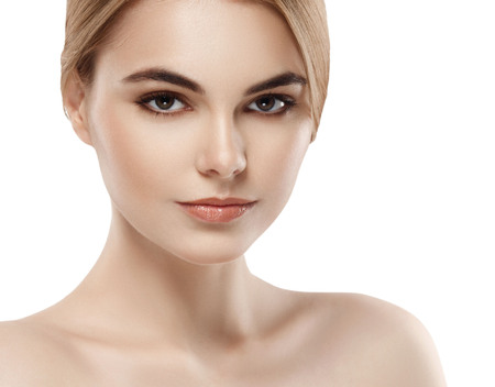 Beautiful woman face close up portrait young . Isolated on white. Studio shot.の写真素材