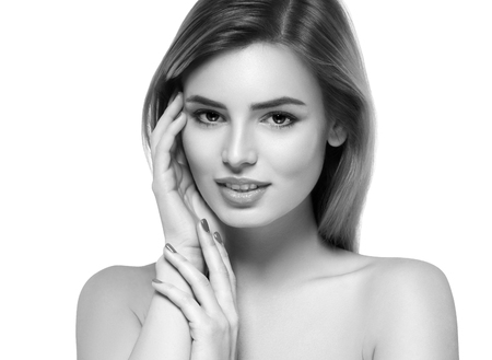 Beautiful woman portrait face. Isolated on white. Black and white. Studio shot.の写真素材