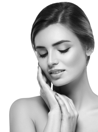 Beautiful woman portrait face. Isolated on white. Black and white. Studio shot.の写真素材