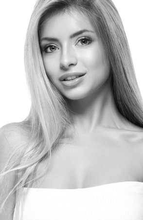 Beautiful woman face close up on white black and white. Studio shot.の写真素材